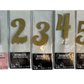 Gold number cake toppers in packaging. Numbers 1, 2, 3, 4, and 5 are shown.