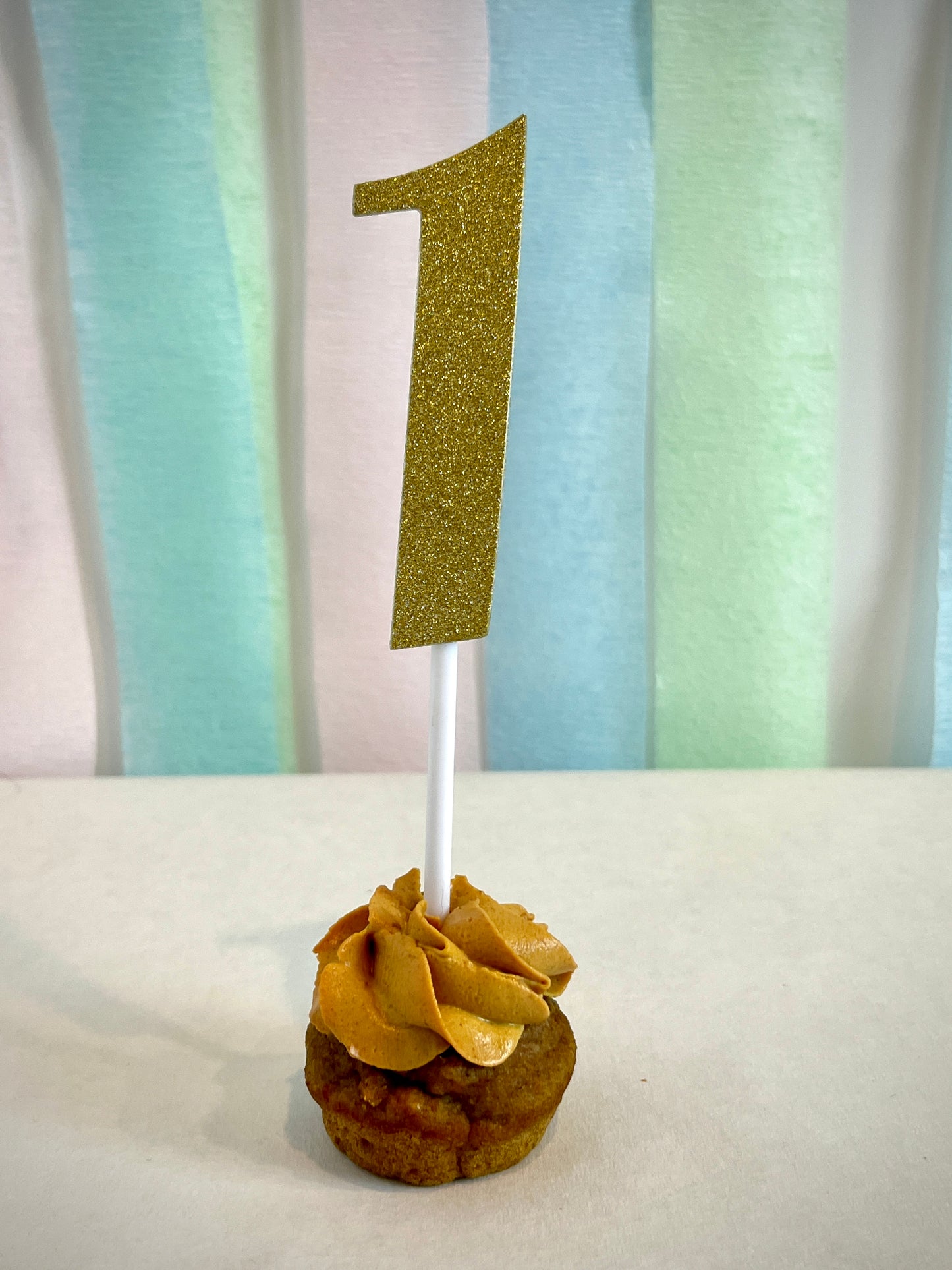 Classic swirl custom dog mini cupcake with gold glitter "one" number topper.